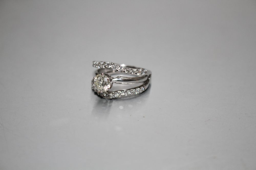 A modern 14kt white metal and triple band diamond dress ring,